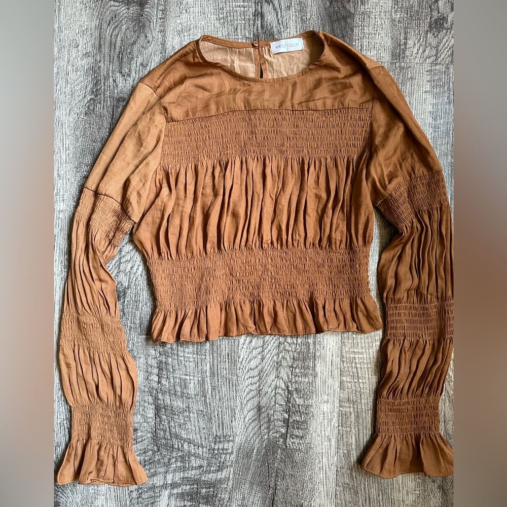 Vestique waistline top